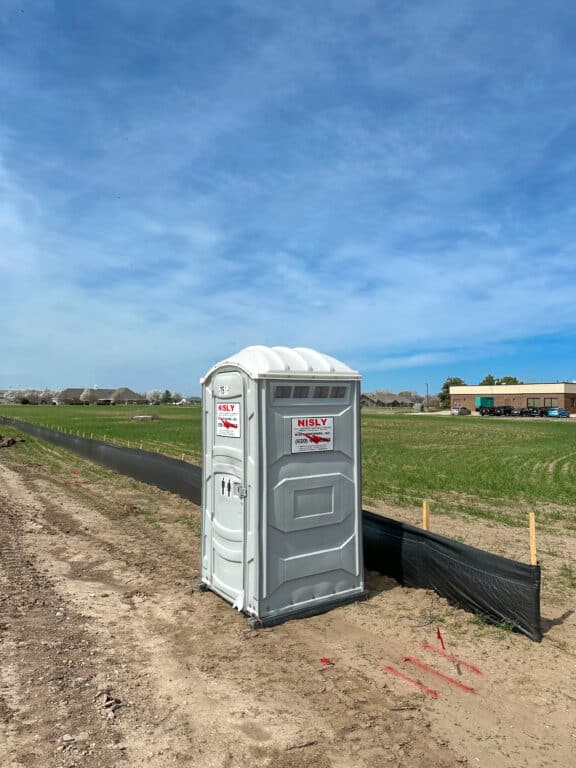 Portable toilet at construction site